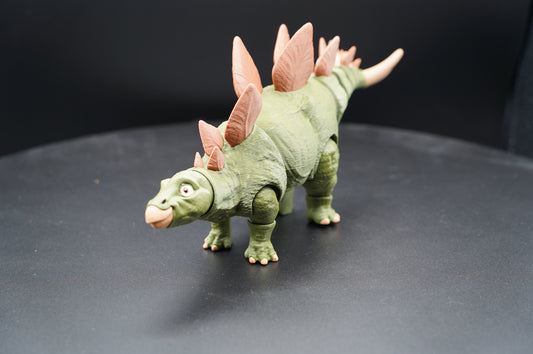 Articulated 3D printed Stegosaurus figurine - rear three-quarter view showing dorsal plates and thagomizer tail